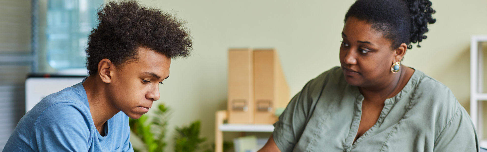 teenage boy having a therapy session with psychiatrist